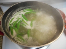Toss the asparagus and sugar snap peas right into the pasta water the last few minutes of cooking.